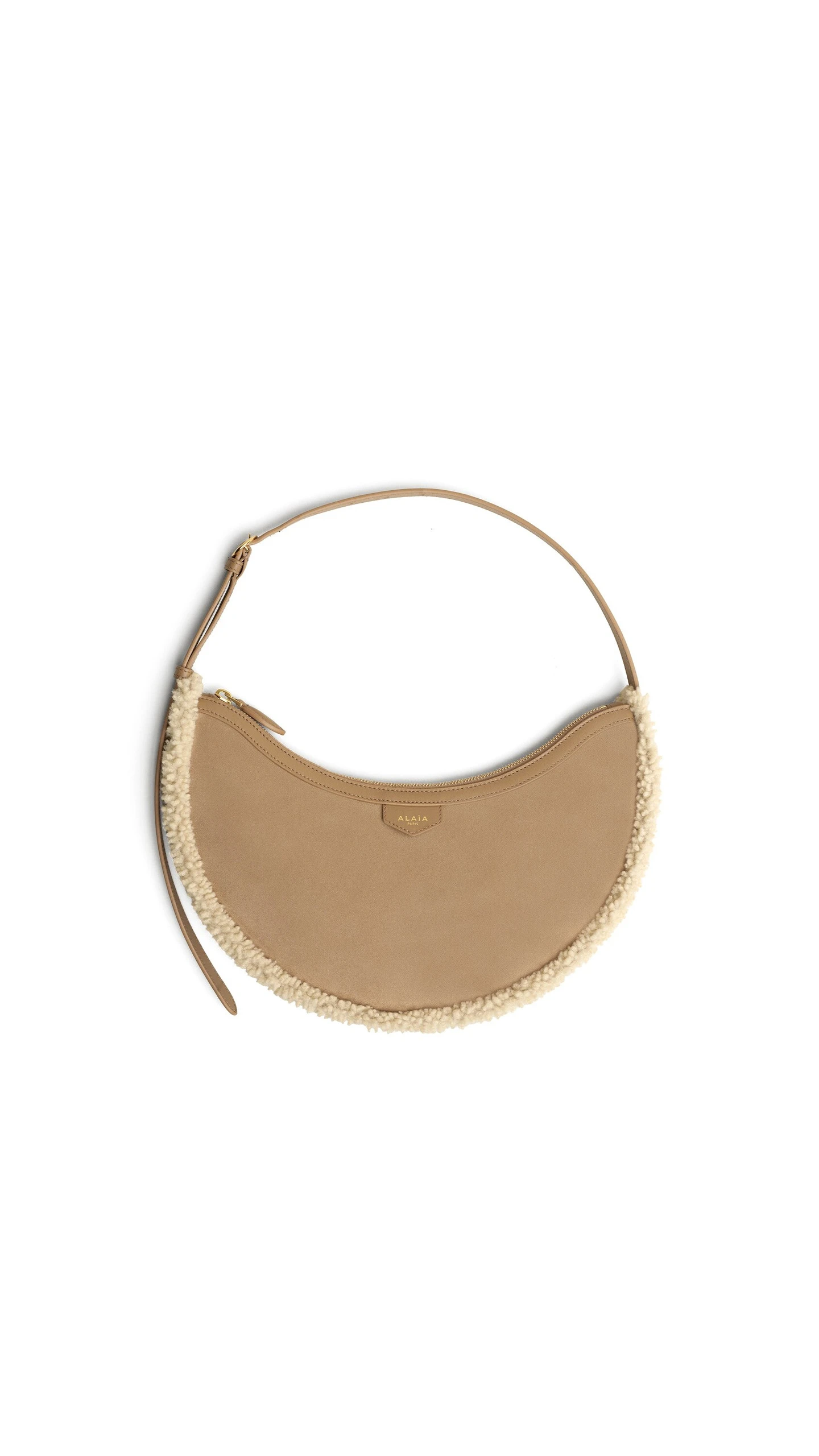 Alaia One Piece Demi Lune Bag in Merino Shearling, Camel Alaia One Piece Demi Lune Bag in Merino Shearling, Camel | Shoulder & Crossbody Bags | Coveti