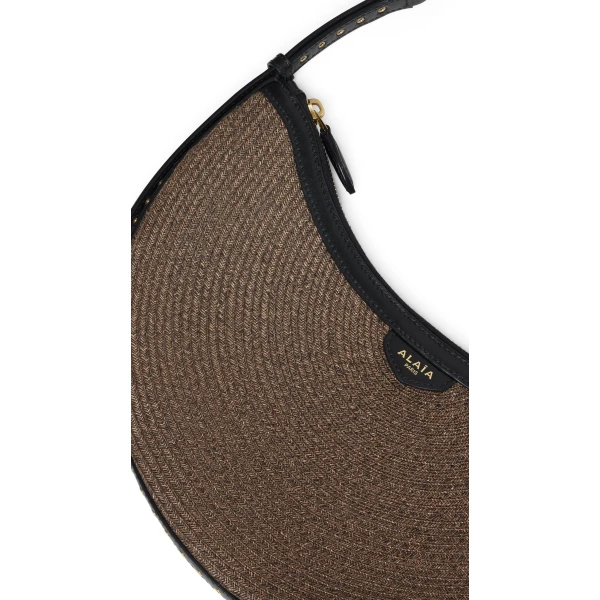 Alaia One Piece Demi Lune Bag in Paper Straw, Brown | Shoulder & Crossbody Bags | Coveti