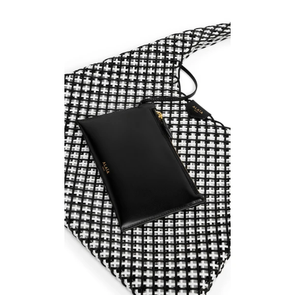 Alaia One Piece Hobo Bag in Leather Net, Black and White | Shoulder & Crossbody Bags | Coveti