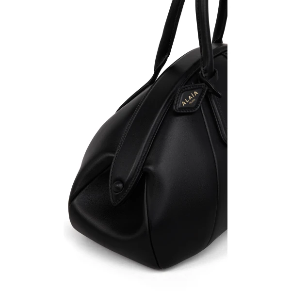 Alaia Purse Top Handle Bag in Calfskin, Black | Totes & Top-Handle Bags | Coveti