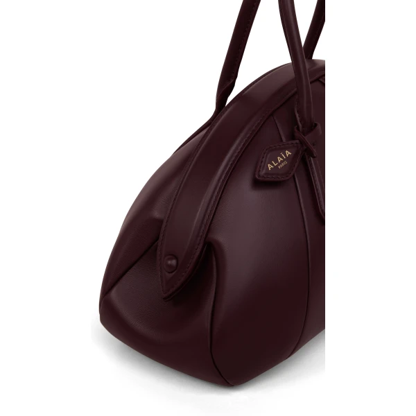 Alaia Purse Top Handle Bag in Calfskin, Bordeaux | Totes & Top-Handle Bags | Coveti