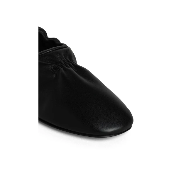 Alaia Supple Slippers in Leather, Black | Flats | Coveti