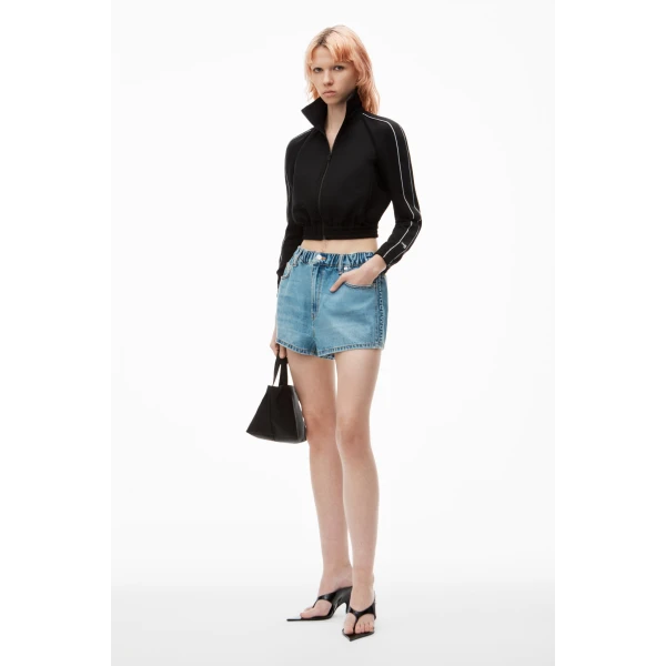 Alexander Wang Balloon Logo-Embossed Denim Marathon Short in Vintage Light Indigo | Denim Shorts | Coveti