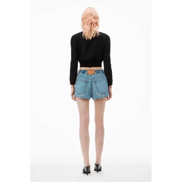 Alexander Wang Balloon Logo-Embossed Denim Marathon Short in Vintage Light Indigo | Denim Shorts | Coveti