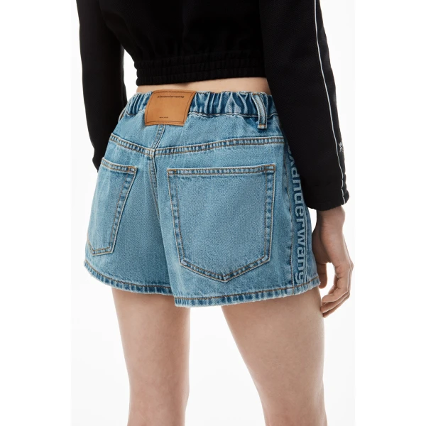 Alexander Wang Balloon Logo-Embossed Denim Marathon Short in Vintage Light Indigo | Denim Shorts | Coveti