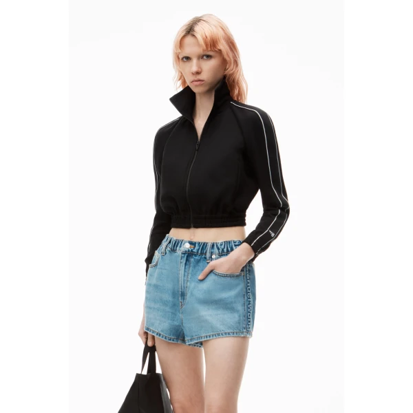 Alexander Wang Balloon Logo-Embossed Denim Marathon Short in Vintage Light Indigo | Denim Shorts | Coveti