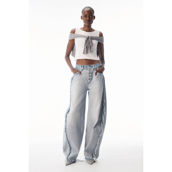 Alexander Wang Blow Up Logo-Embossed Mid-Rise Inverted Jean in Inverted Bleach Blue | Denim | Coveti