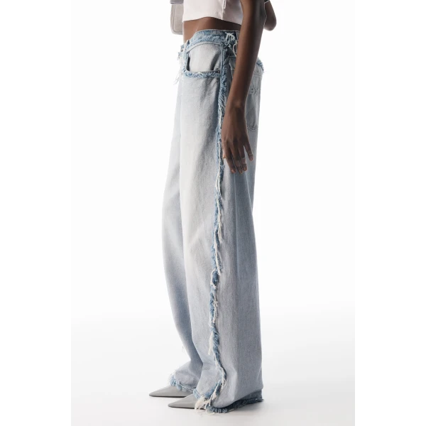 Alexander Wang Blow Up Logo-Embossed Mid-Rise Inverted Jean in Inverted Bleach Blue | Denim | Coveti