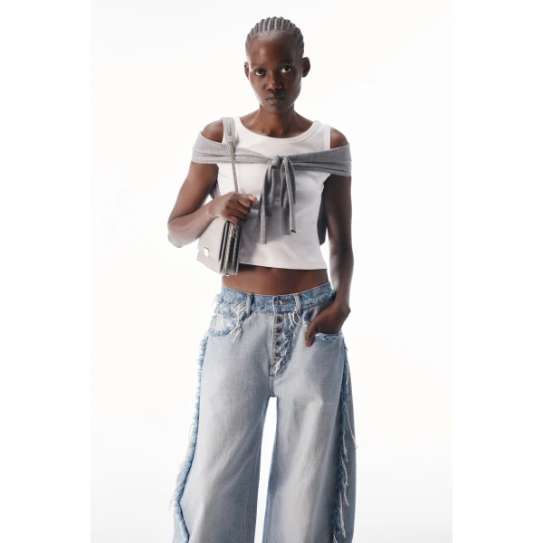 Alexander Wang Blow Up Logo-Embossed Mid-Rise Inverted Jean in Inverted Bleach Blue | Denim | Coveti
