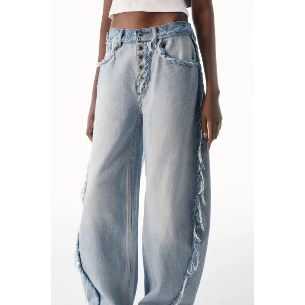 Alexander Wang Blow Up Logo-Embossed Mid-Rise Inverted Jean in Inverted Bleach Blue | Denim | Coveti