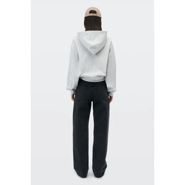 Alexander Wang Float Mid-Rise Relaxed Crystal Hotfix Logo Fly Jean in Faded Black | Denim | Coveti