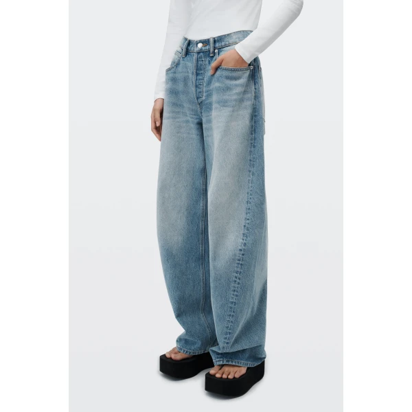 Alexander Wang Float Mid-Rise Relaxed Jean in Tinted Medium Indigo | Denim | Coveti