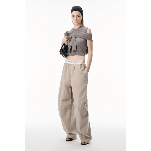 Alexander Wang Mid-Rise Pleated Wide-Leg Pant with Logo Elastic Waist in Stone | Wide leg pants | Coveti