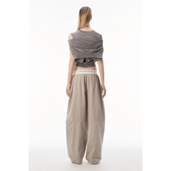 Alexander Wang Mid-Rise Pleated Wide-Leg Pant with Logo Elastic Waist in Stone | Wide leg pants | Coveti