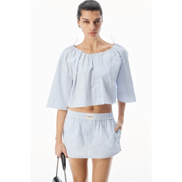 Alexander Wang Off-Shoulder Cropped Shirt with Bungee Drawcord in White and Blue | Shirts | Coveti