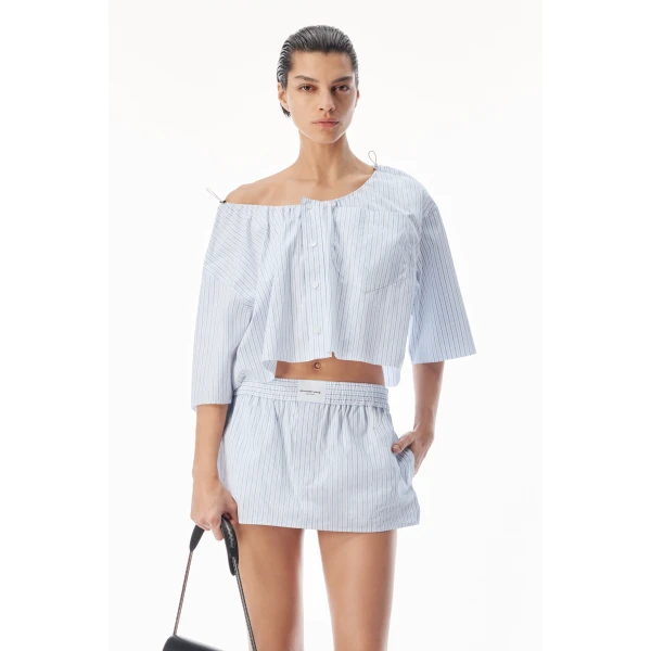 Alexander Wang Off-Shoulder Cropped Shirt with Bungee Drawcord in White and Blue | Shirts | Coveti