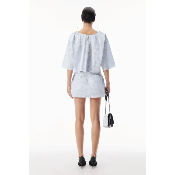 Alexander Wang Off-Shoulder Cropped Shirt with Bungee Drawcord in White and Blue | Shirts | Coveti