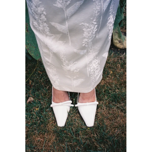 Bernadette Bowtie Lacquered High Heel Pump in Ivory | Heels | Coveti