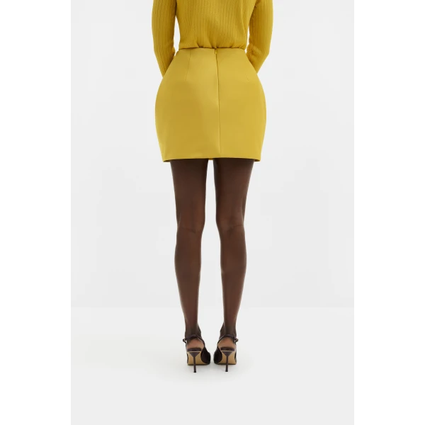 By Malina Ellis Mini Skirt in Mango | Mini Skirts | Coveti