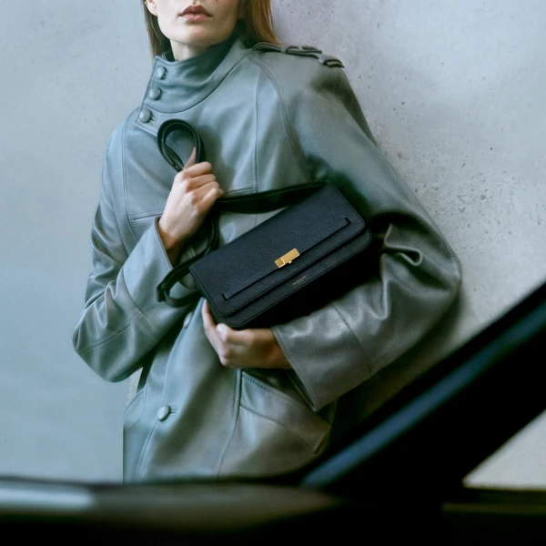 DeMellier The New York Crossbody in Black Small Grain Crossbody Bag, view 2 | Shoulder & Crossbody Bags | Coveti