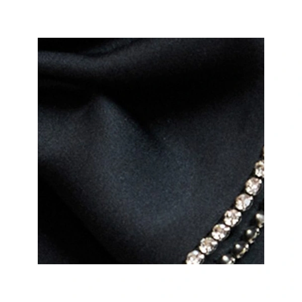 Essentiel Antwerp Black rhinestone-trimmed bow brooch | Brooches & Pins | Coveti