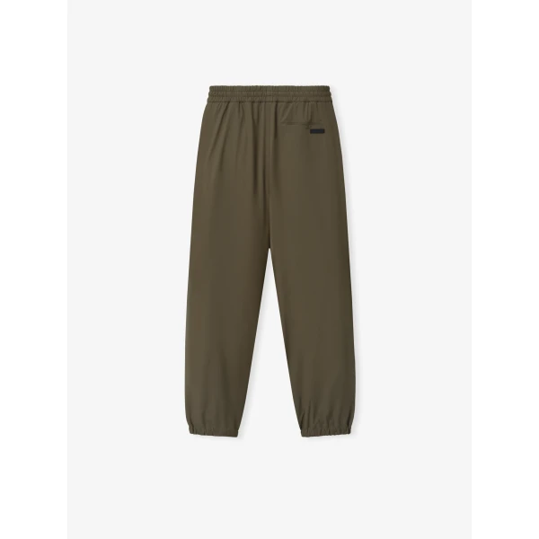 Fear of God Bonded Nylon Tech Track Pants in Forest | Pants | Coveti