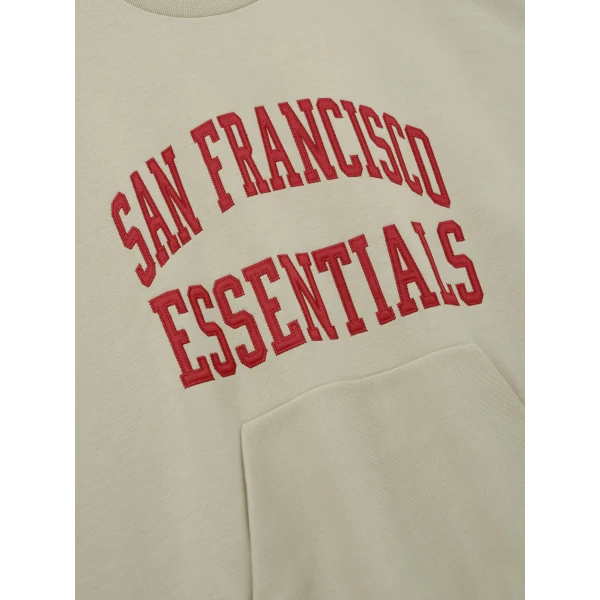 Fear of God Essentials 49ers 90s Relaxed Crewneck in Sandstone | Sweatshirts | Coveti