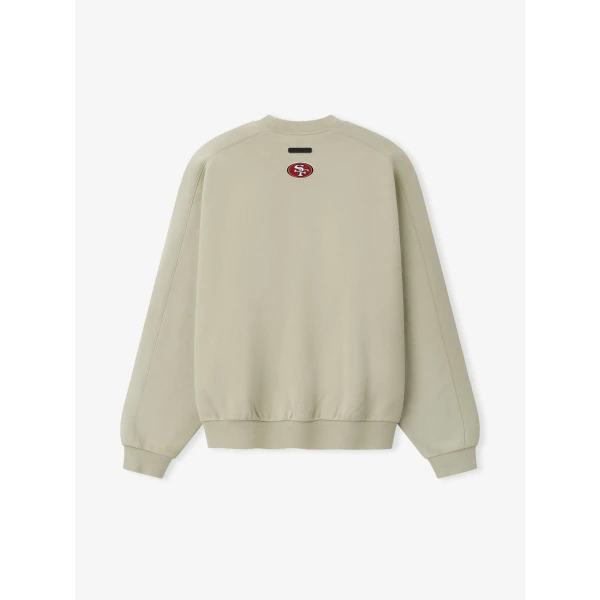 Fear of God Essentials 49ers 90s Relaxed Crewneck in Sandstone | Sweatshirts | Coveti