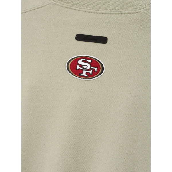 Fear of God Essentials 49ers 90s Relaxed Crewneck in Sandstone | Sweatshirts | Coveti