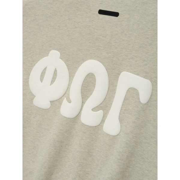 Fear of God Essentials 90s Sweatshirt in Washed Vanilla Heather | Sweatshirts | Coveti