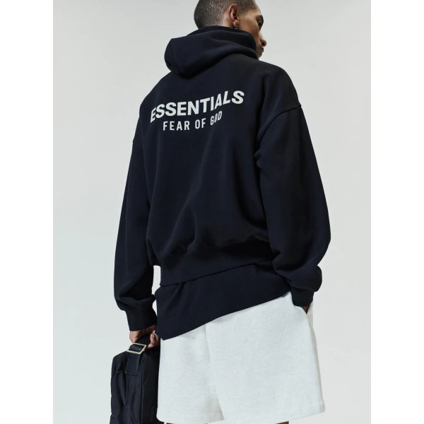 Fear of God Essentials Back Logo Classic Hoodie in Black | Sweatshirts | Coveti