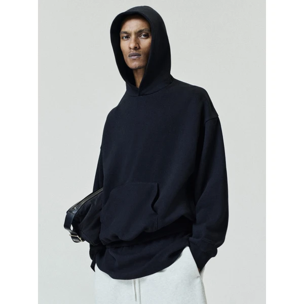 Fear of God Essentials Back Logo Classic Hoodie in Black | Sweatshirts | Coveti