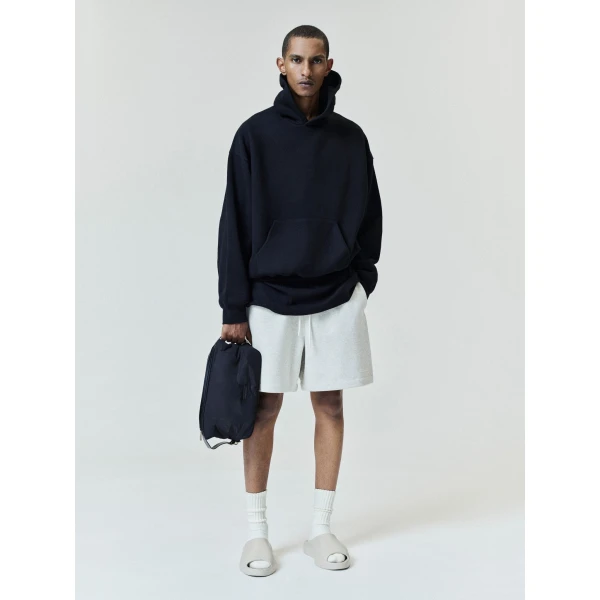Fear of God Essentials Back Logo Classic Hoodie in Black | Sweatshirts | Coveti