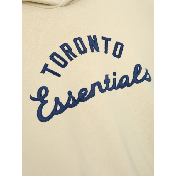 Fear of God Essentials Blue Jays Sport Hoodie in Oat | Sweatshirts | Coveti
