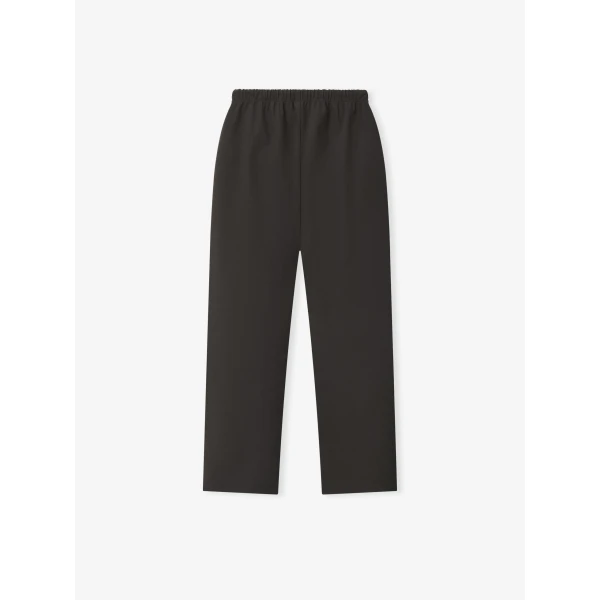 Fear of God Essentials Bonded Nylon Signature Classic Track Pant in Ink Black | Pants | Coveti