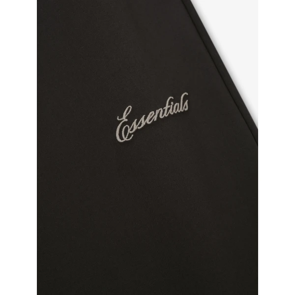 Fear of God Essentials Bonded Nylon Signature Classic Track Pant in Ink Black | Pants | Coveti