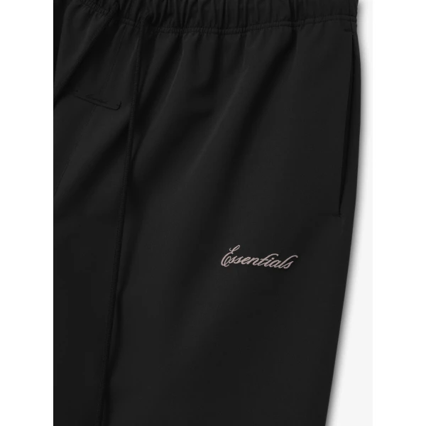 Fear of God Essentials Bonded Nylon Signature Relaxed Short with Slit in Black | Shorts | Coveti