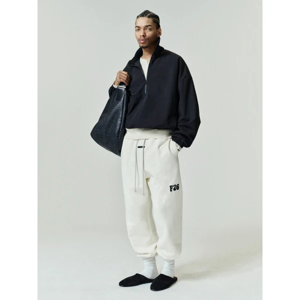 Fear of God Essentials Classic Fleece Sweatpant in Washed Ivory | Pants | Coveti