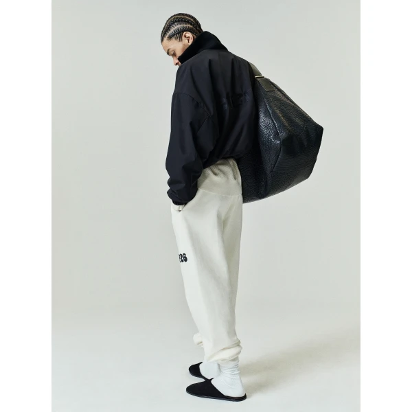 Fear of God Essentials Classic Fleece Sweatpant in Washed Ivory | Pants | Coveti