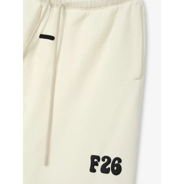 Fear of God Essentials Classic Fleece Sweatpant in Washed Ivory | Pants | Coveti