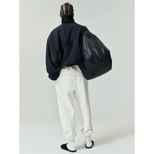 Fear of God Essentials Classic Fleece Sweatpant in Washed Ivory | Pants | Coveti
