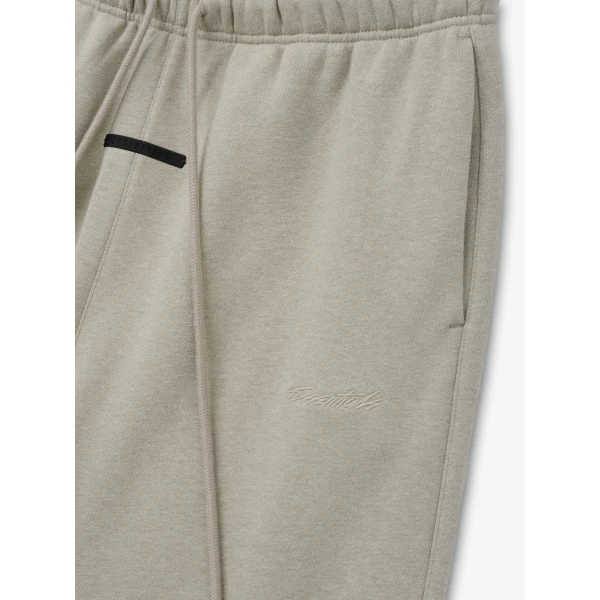 Fear of God Essentials Classic Slouchy Sweatpant in Pyrite Heather | Pants | Coveti