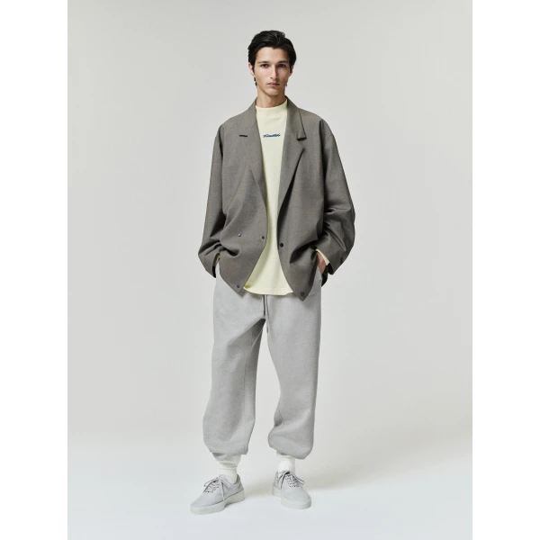 Fear of God Essentials Classic Slouchy Sweatpant in Pyrite Heather | Pants | Coveti