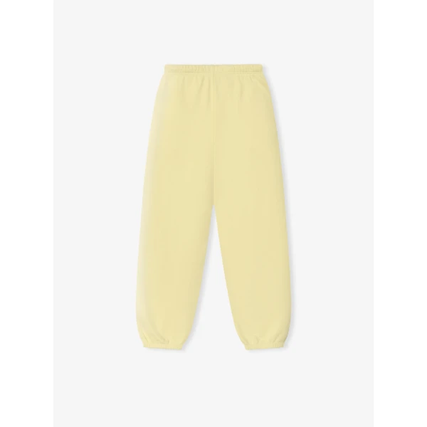 Fear of God Essentials Classic Slouchy Sweatpant in Washed Sulphur | Pants | Coveti