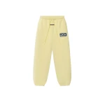 Fear of God Essentials Classic Slouchy Sweatpant in Washed Sulphur | Coveti