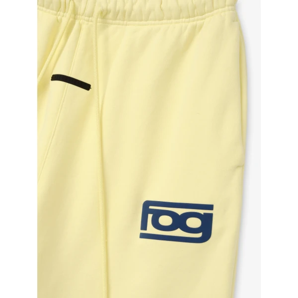 Fear of God Essentials Classic Slouchy Sweatpant in Washed Sulphur | Pants | Coveti