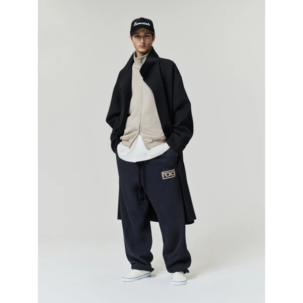 Fear of God Essentials Classic Slouchy Sweatpant in Washed Vintage Black | Pants | Coveti