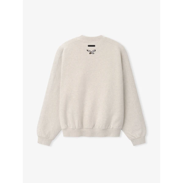 Fear of God Essentials Eagles 90s Relaxed Crewneck in Marble Heather | Sweatshirts | Coveti
