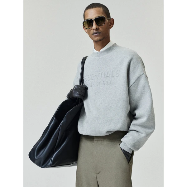 Fear of God Essentials Embossed 90s Relaxed Crewneck in Warm Heather | Sweatshirts | Coveti