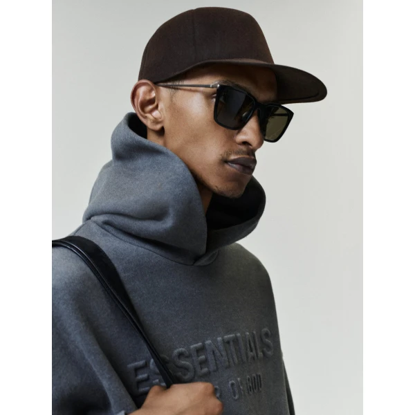 Fear of God Essentials Embossed 90s Relaxed Hoodie in Ash Heather | Sweatshirts | Coveti